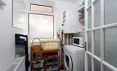 The utility-room has a washing machine. - Thumbnail Image