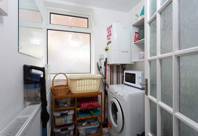 The utility-room has a washing machine.