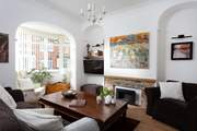 The cosy sitting-room has plenty of seating for everyone.