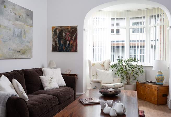 Light floods in they the bay window.