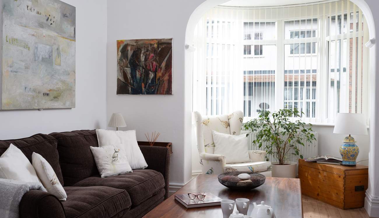 Light floods in they the bay window.