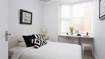 Another bright and pretty bedroom.