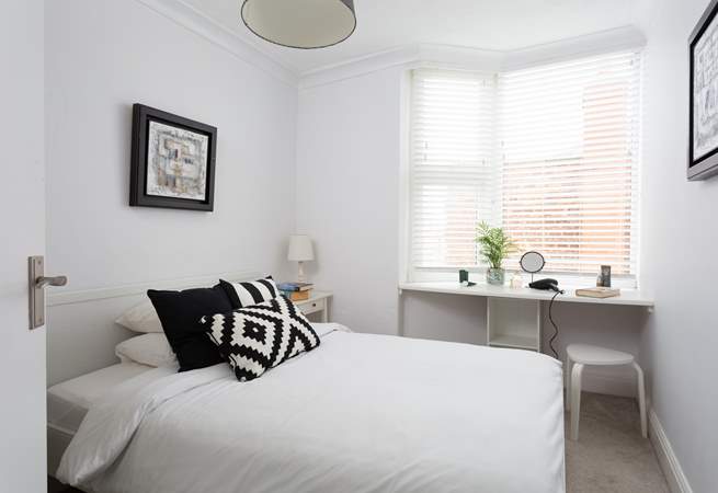 Another bright and pretty bedroom.