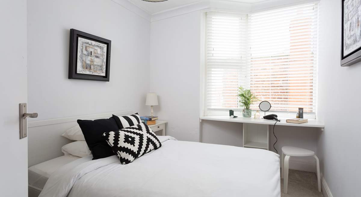 Another bright and pretty bedroom.