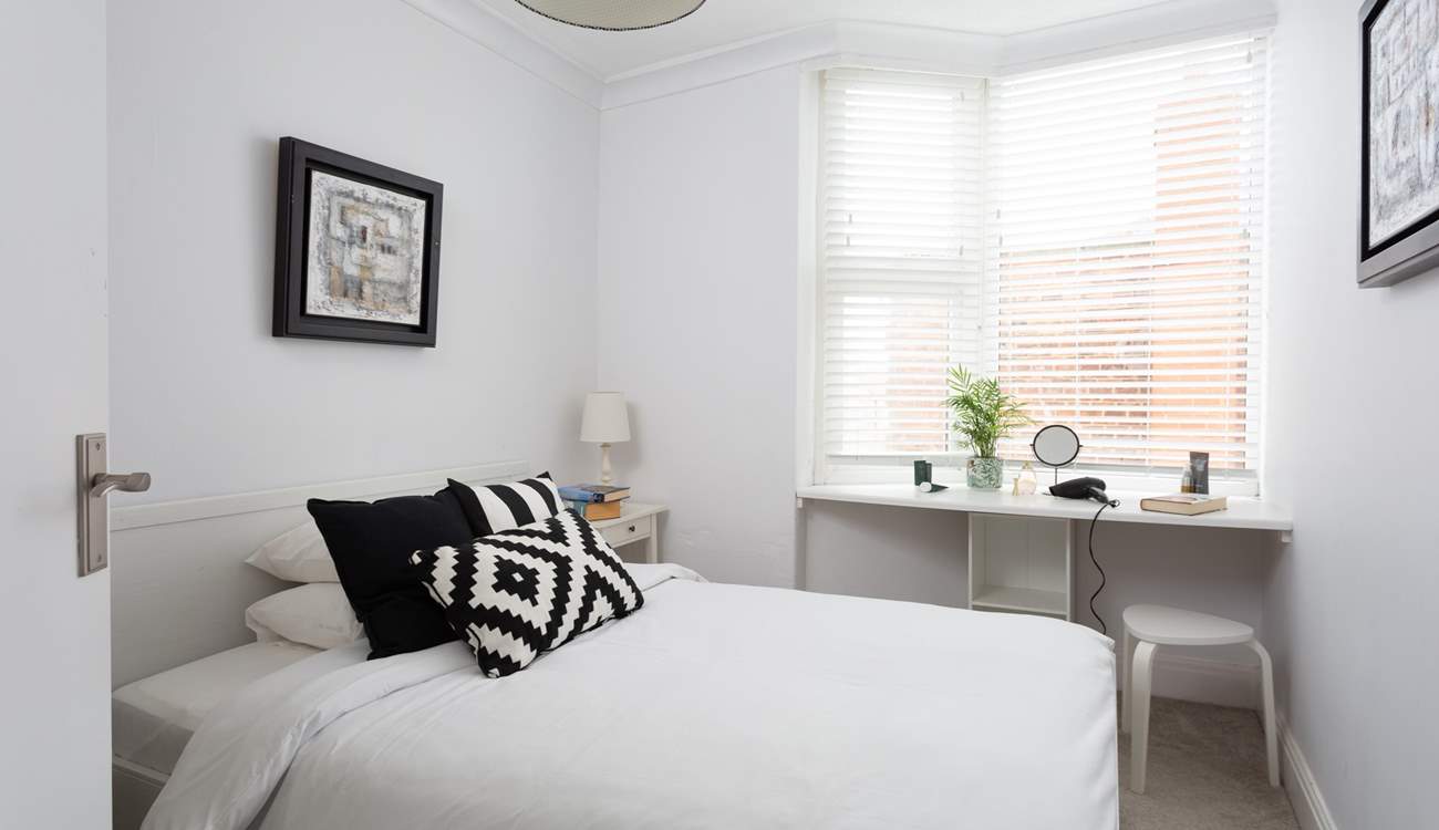 Another bright and pretty bedroom.