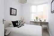 Another bright and pretty bedroom.