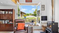 Fling open the huge windows and enjoy the feel of being outside, from the comfort of the sitting-room.