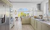 Looking down through the kitchen to the dining-area and patio doors. - Thumbnail Image