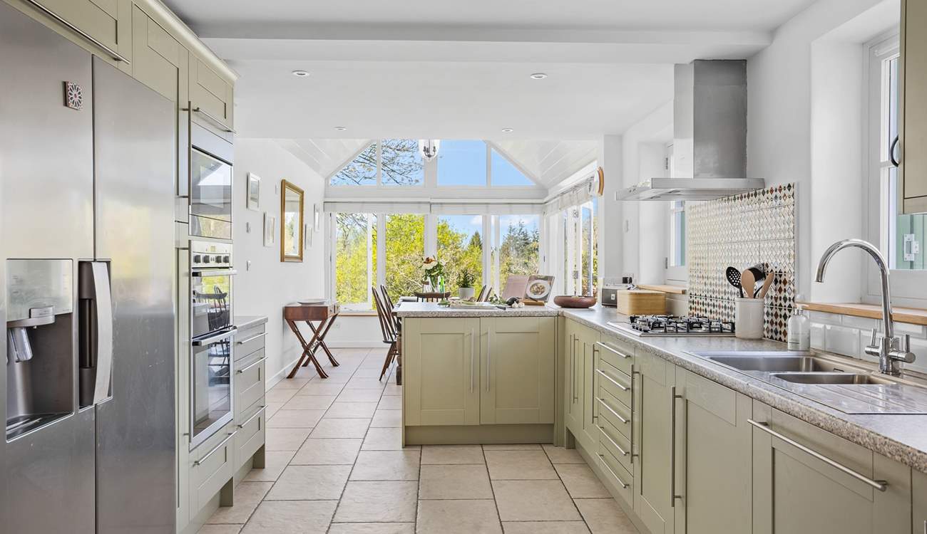 Looking down through the kitchen to the dining-area and patio doors.