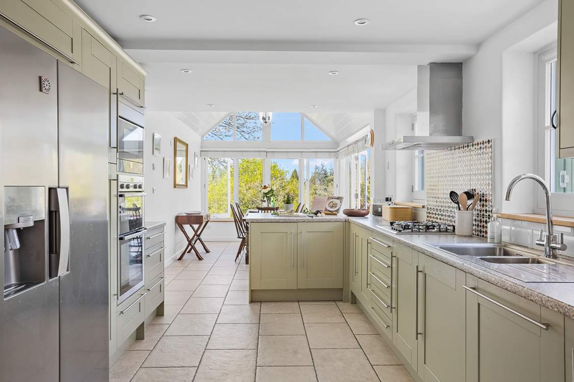 Looking down through the kitchen to the dining-area and patio doors.
