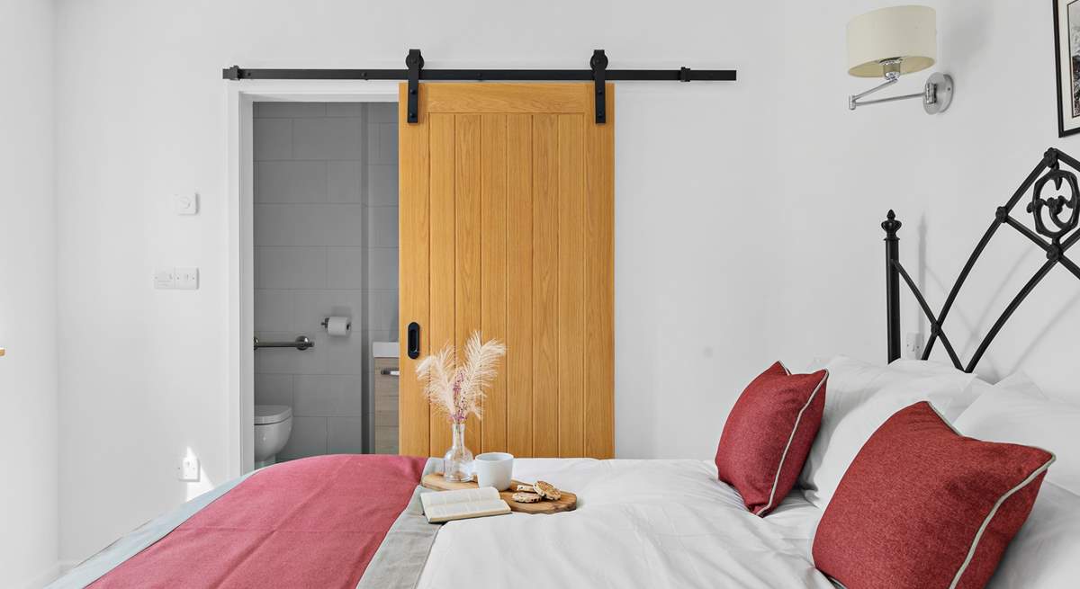Bedroom 1 also has a shower-room cleverly tucked away behind a sliding door.