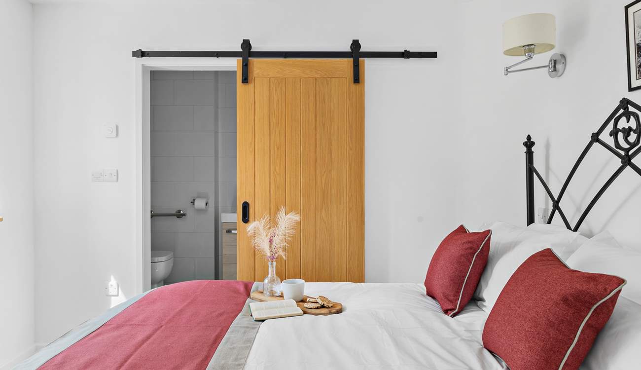 Bedroom 1 also has a shower-room cleverly tucked away behind a sliding door.