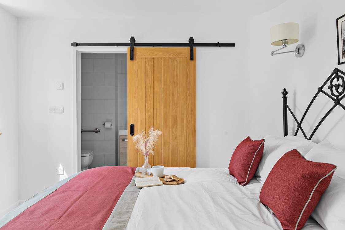 Bedroom 1 also has a shower-room cleverly tucked away behind a sliding door.