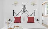 Welcome to bedroom 1, located on the ground floor, boasting this fabulous king-sized bed. - Thumbnail Image