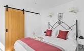 Bedroom 1 is home to this king-size bed. - Thumbnail Image