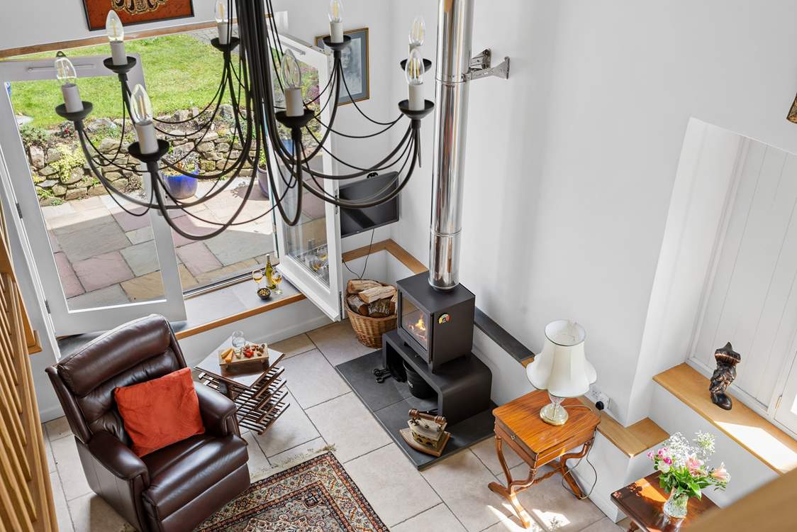 Looking down from the mezzanine level into the main ground floor sitting-room.