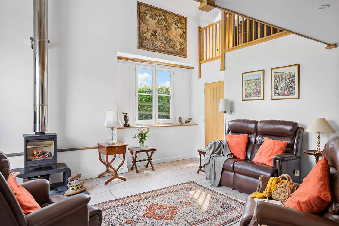 The sitting-room is a welcoming and cosy space.
