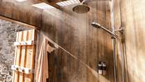Enjoy a hot rainfall shower after a wild swim at your private beach. 