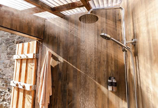 Enjoy a hot rainfall shower after a wild swim at your private beach. 