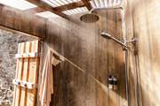 Enjoy a hot rainfall shower after a wild swim at your private beach.