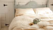 Start your day with a cup of tea in the sweet double bed. 