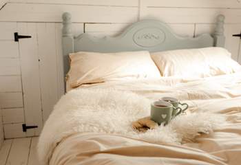 Start your day with a cup of tea in the sweet double bed. 