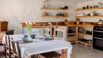The off-grid kitchen is well-equipped for your time spent in nature. 