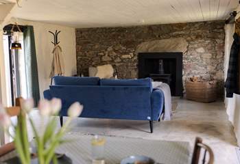 The cosy living space is the perfect spot to settle down with a good book. 