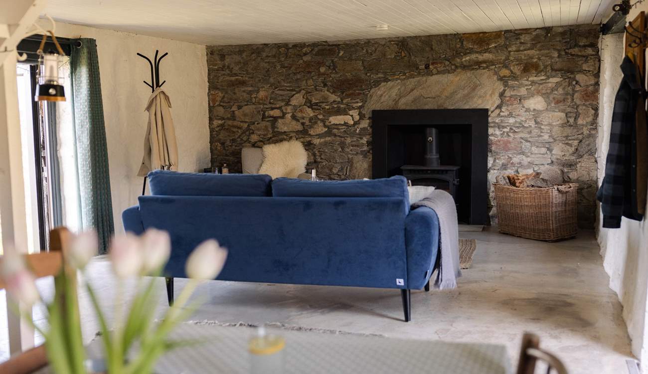 The cosy living space is the perfect spot to settle down with a good book. 