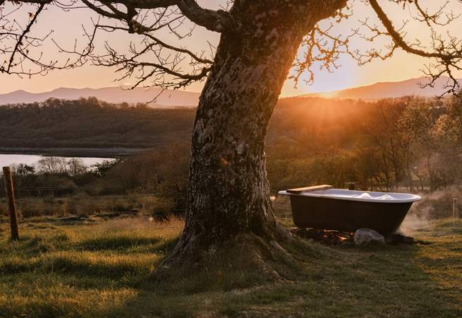 Sink into the outdoor bathtub and soak up the sea views. 