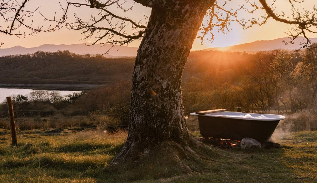 Sink into the outdoor bathtub and soak up the sea views. 