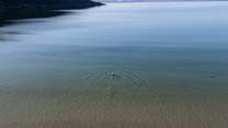 Or take a dip in the glassy water.