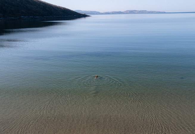 Or take a dip in the glassy water.