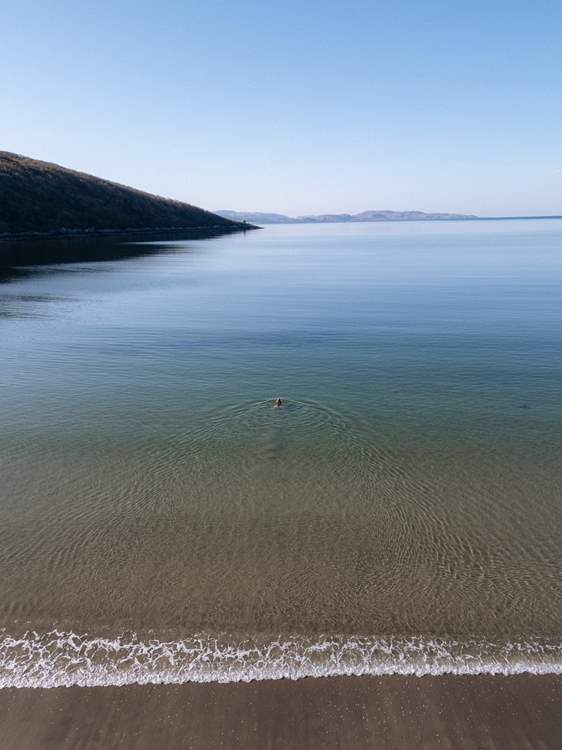 Or take a dip in the glassy water.