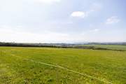 A field with a wonderful far-reaching view, perfect for a leisurely picnic or walking the dogs.