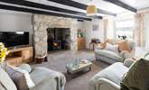 Put your feet up and relax around the cosy wood-burner. - Thumbnail Image
