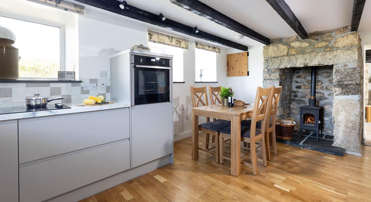 The cottage has a newly appointed kitchen with a sweet wood-burner.