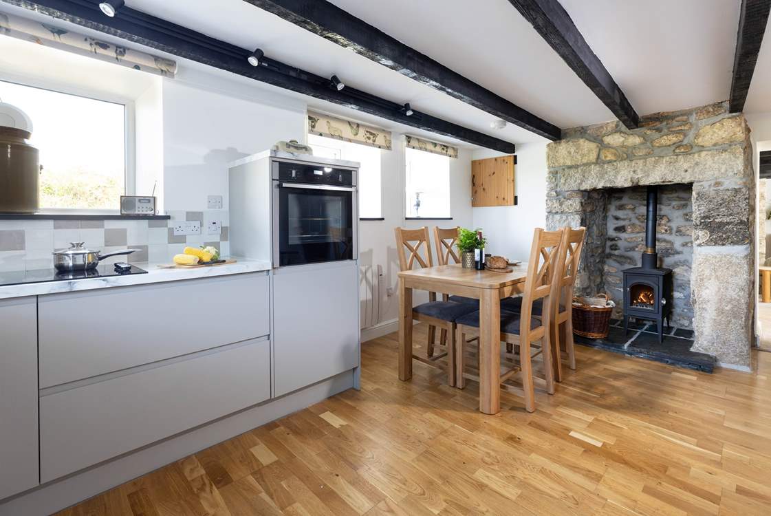 The cottage has a newly appointed kitchen with a sweet wood-burner.