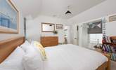 The king-size bedroom with luxurious linens. - Thumbnail Image