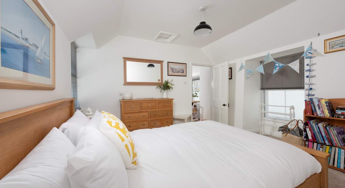 The king-size bedroom with luxurious linens.