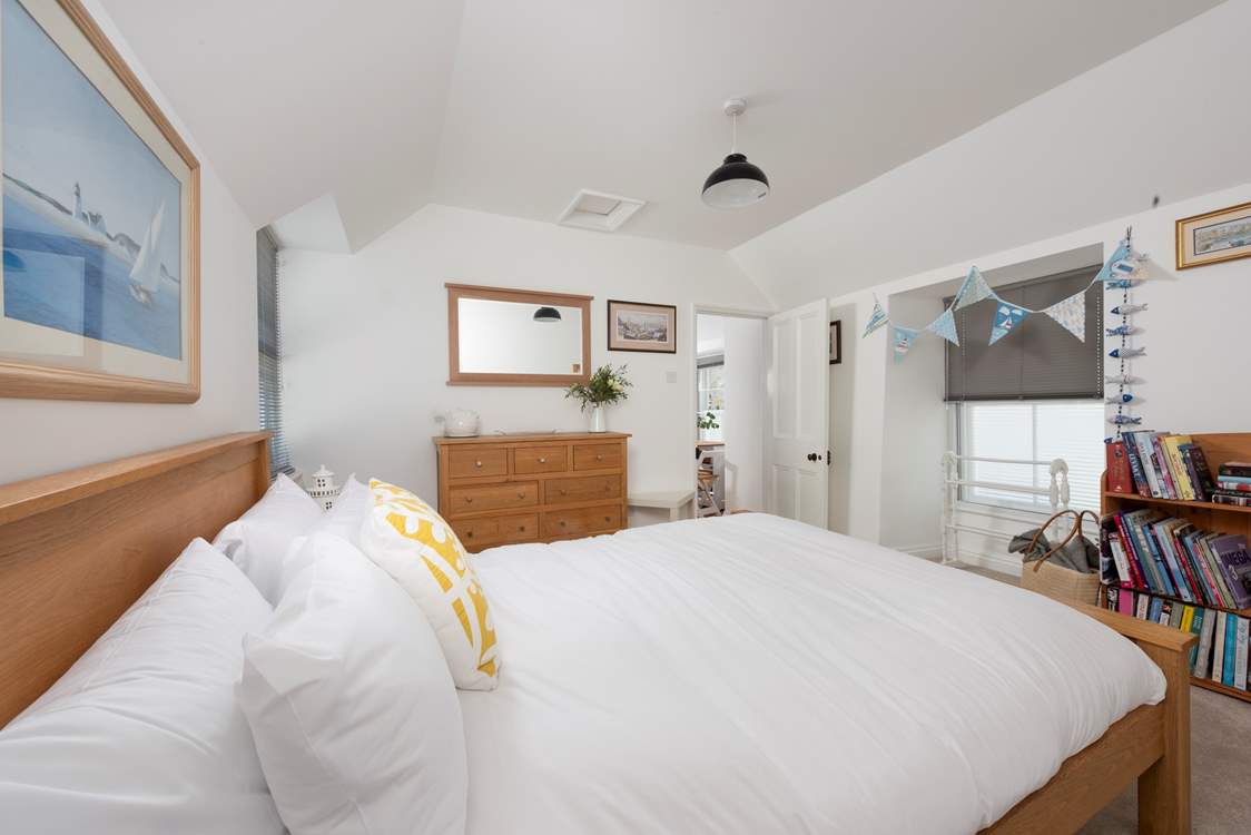 The king-size bedroom with luxurious linens.