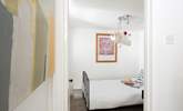 Down the stairs to the sweet single bedroom, tucked away. - Thumbnail Image