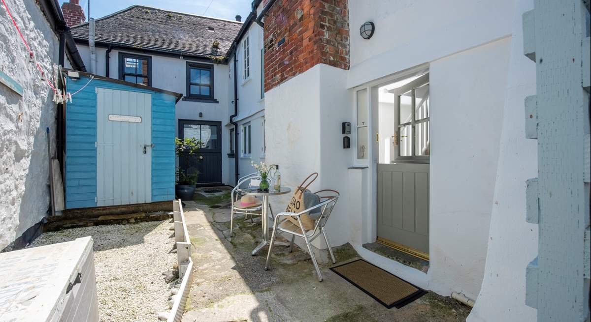 The entrance to the cottage is at the rear in a small courtyard.