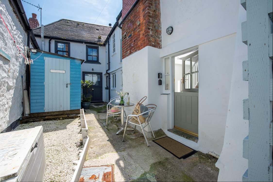 The entrance to the cottage is at the rear in a small courtyard.