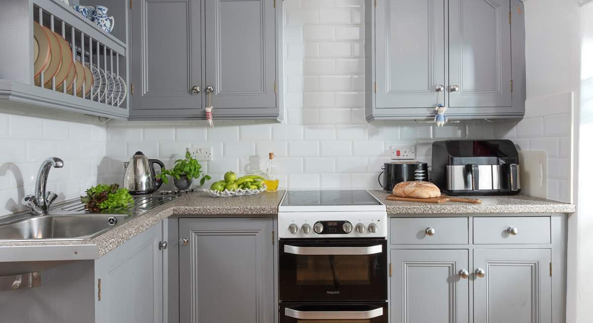 A compact modern kitchen, perfect for preparing a seafood feast purchased from nearby Newlyn.
