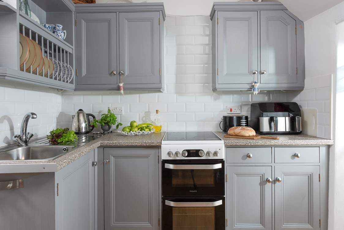 A compact modern kitchen, perfect for preparing a seafood feast purchased from nearby Newlyn.
