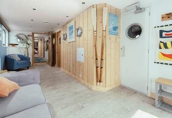 Enter through the Captain's Quarters with nautical decor throughout.