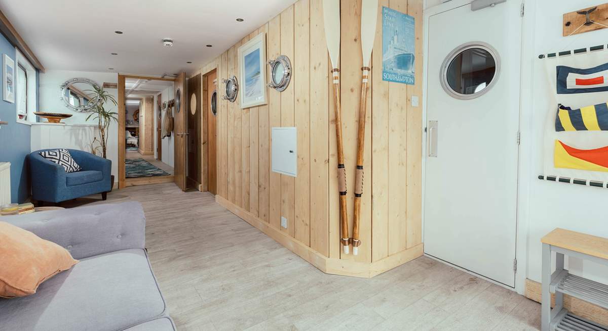 Enter through the Captain's Quarters with nautical decor throughout.