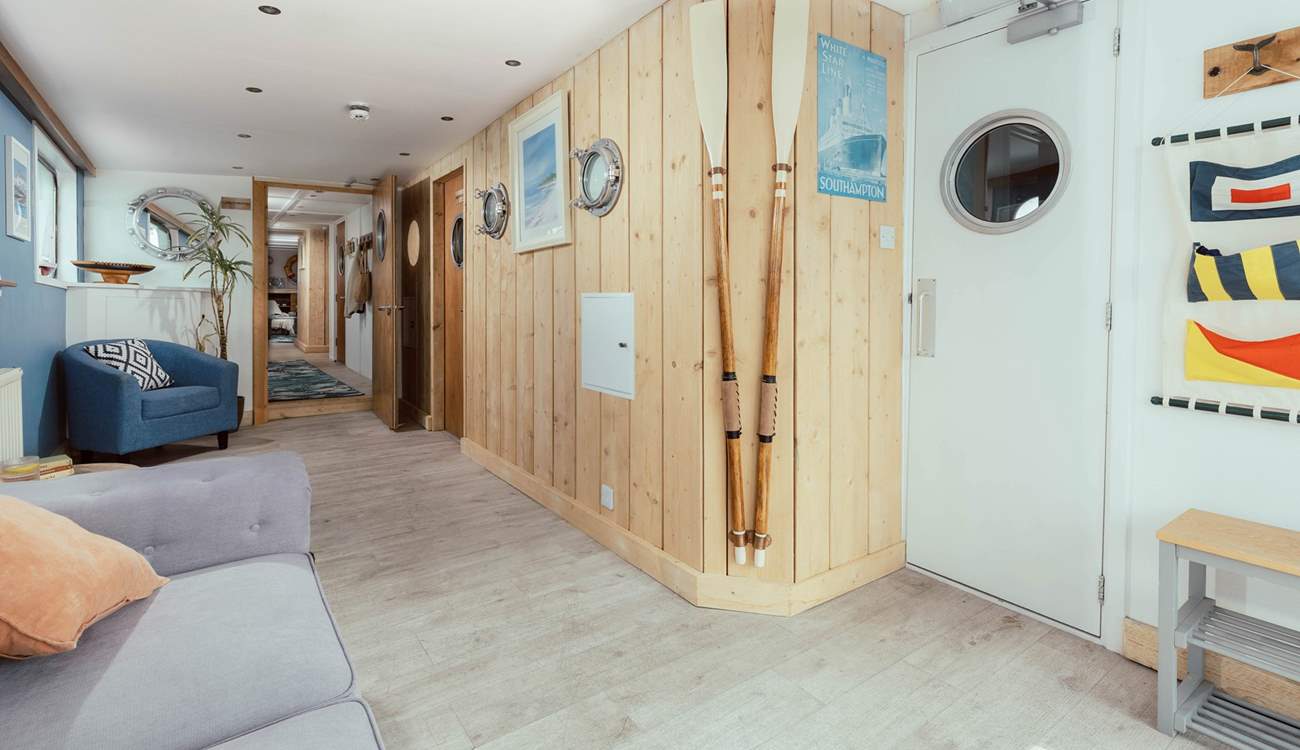 Enter through the Captain's Quarters with nautical decor throughout.
