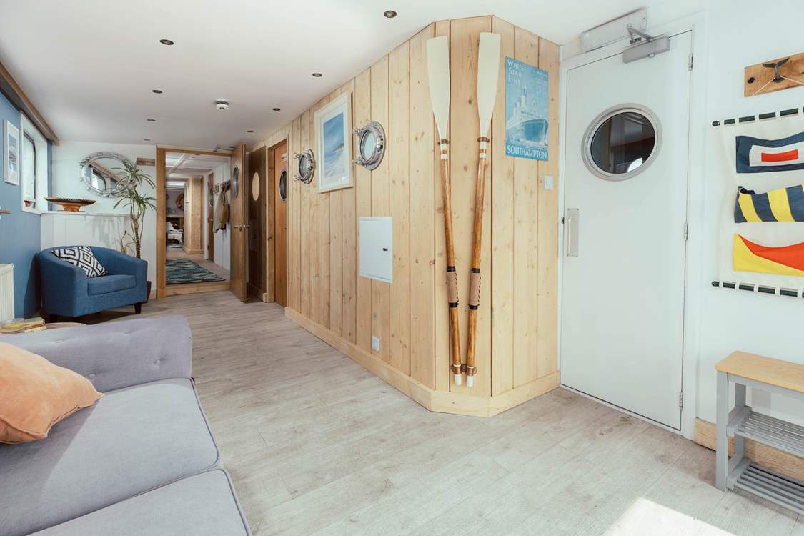 Enter through the Captain's Quarters with nautical decor throughout.